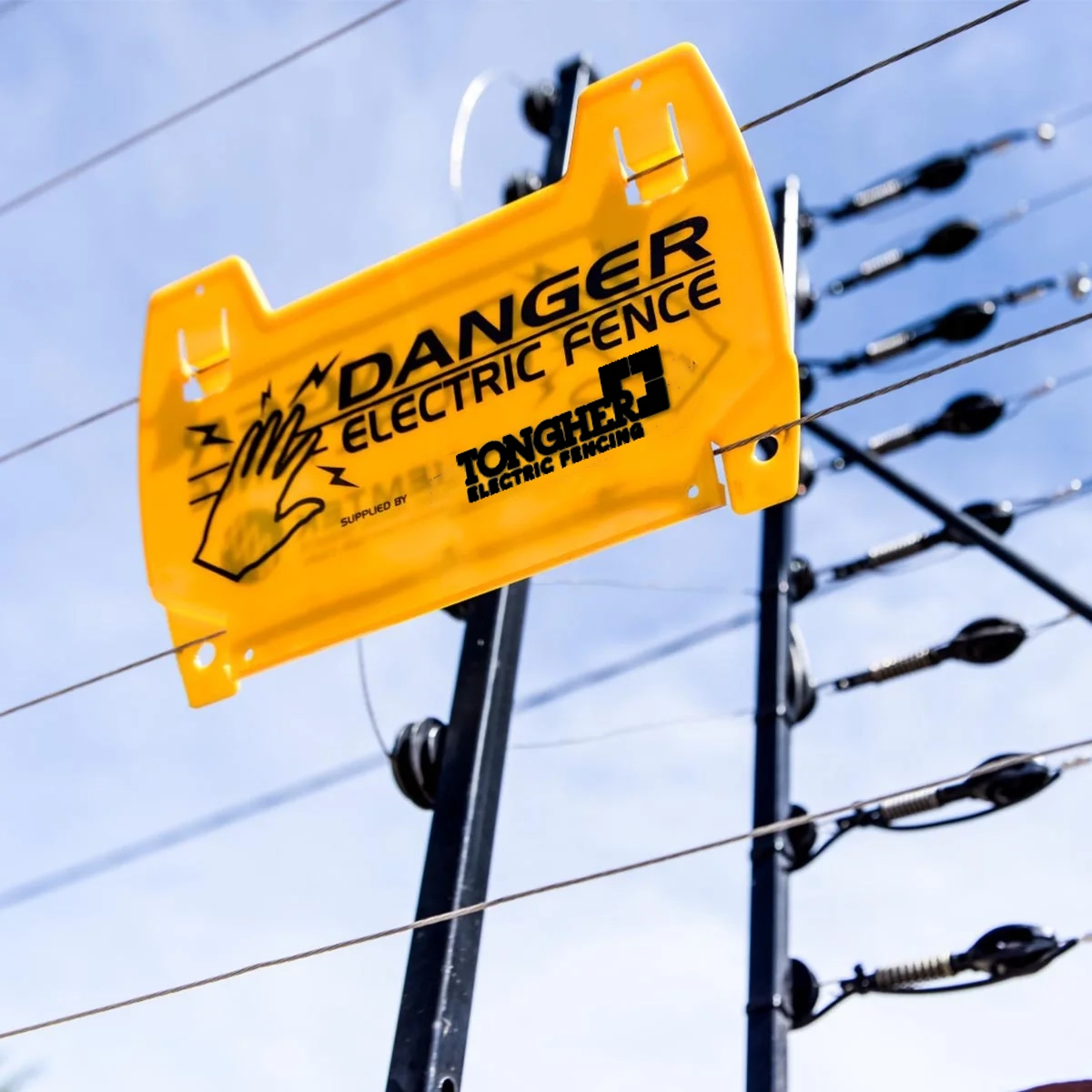 Tongher energizer installed beside a wall-top electric fence in Pakistan